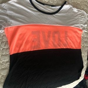 White, pink, black striped top, says LOVE on back